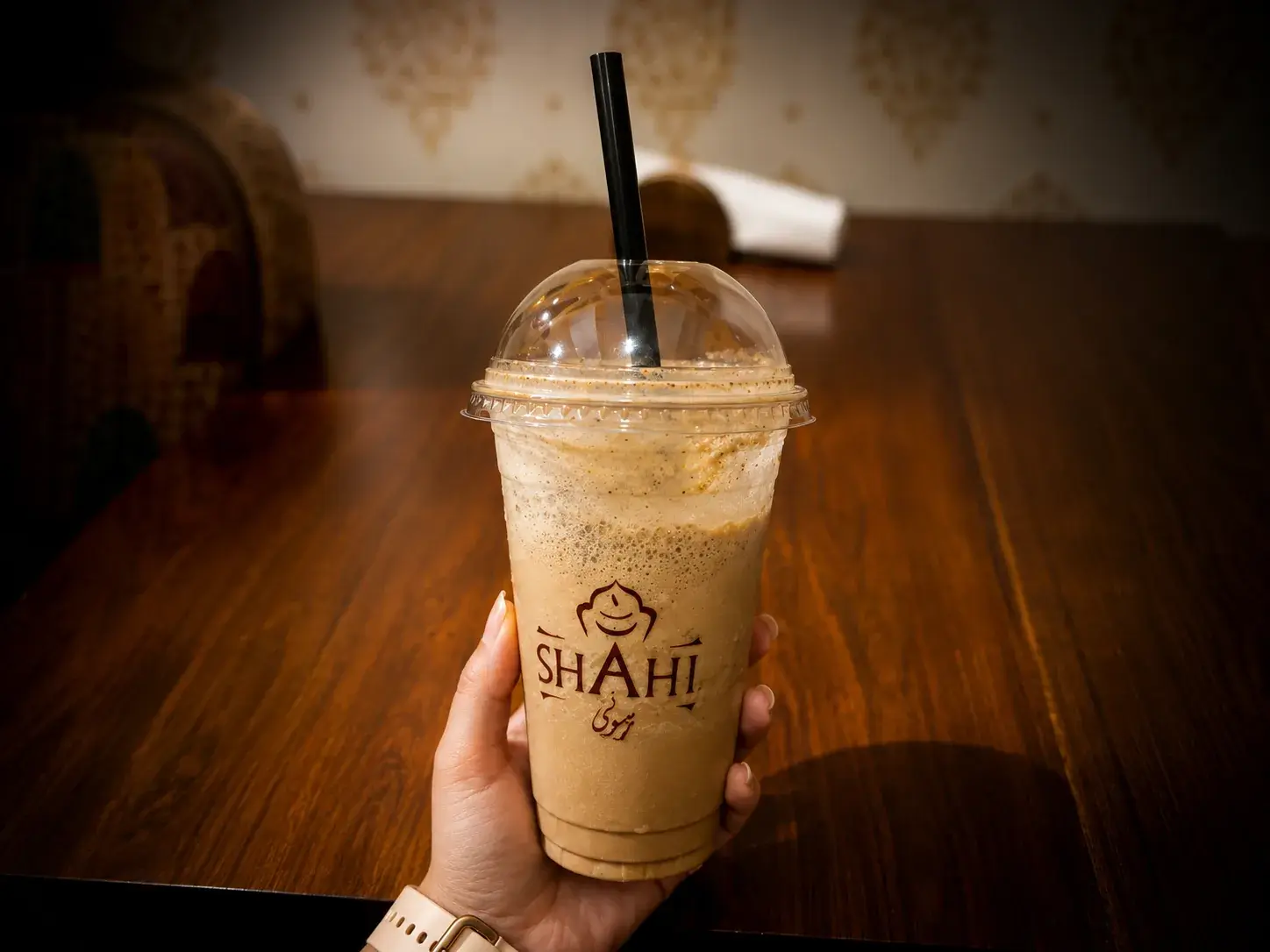 A cold coffee in a branded Shahi Rasoi cup